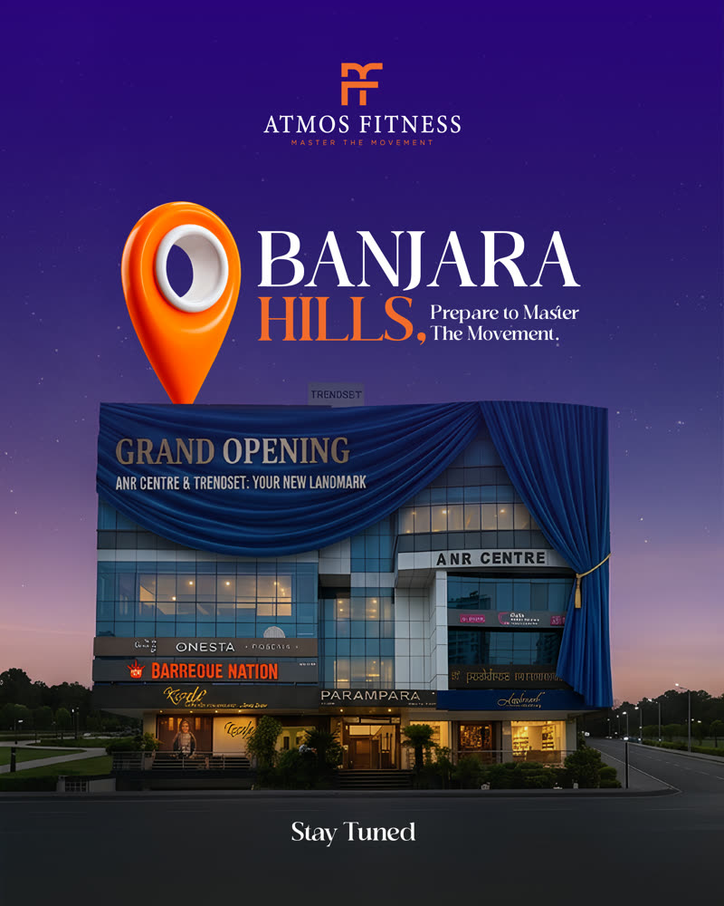 Location reveal — an orange map pin over the ANR Centre and Trendset building at dusk, announcing ATMOS FITNESS in Banjara Hills, Hyderabad.