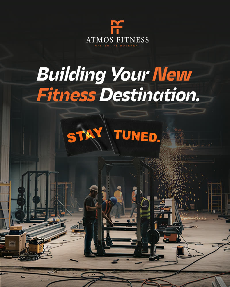 Construction crew assembling a squat rack under hexagonal lighting on the ATMOS FITNESS floor, captioned Building Your New Fitness Destination — Stay Tuned.