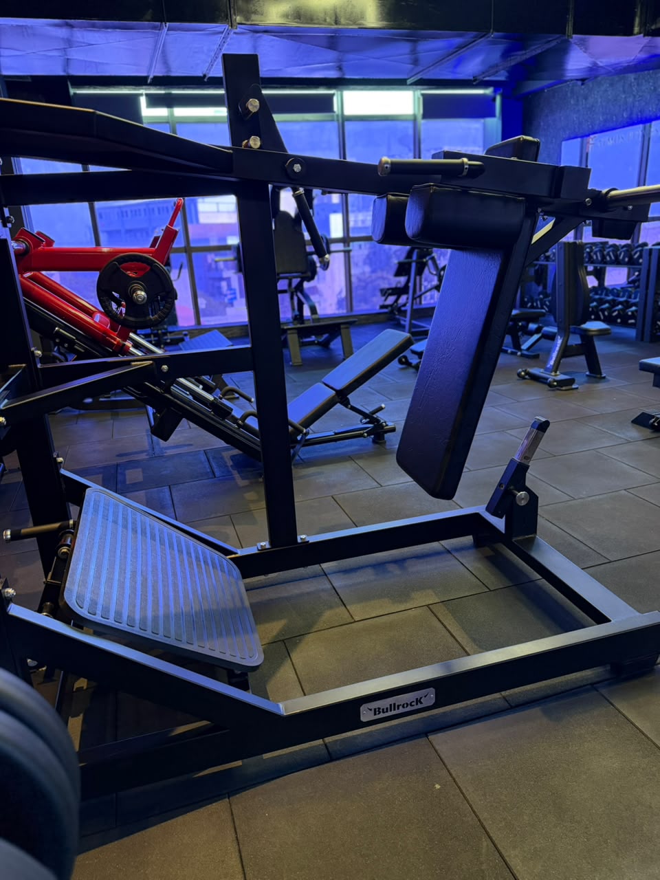Gym equipment under hexagonal ceiling lights