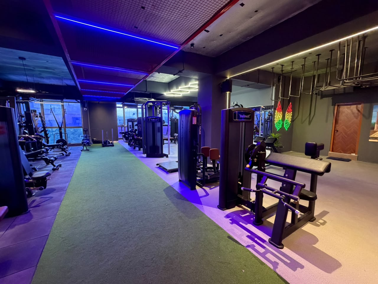 Wide view of the ATMOS training floor with turf lane