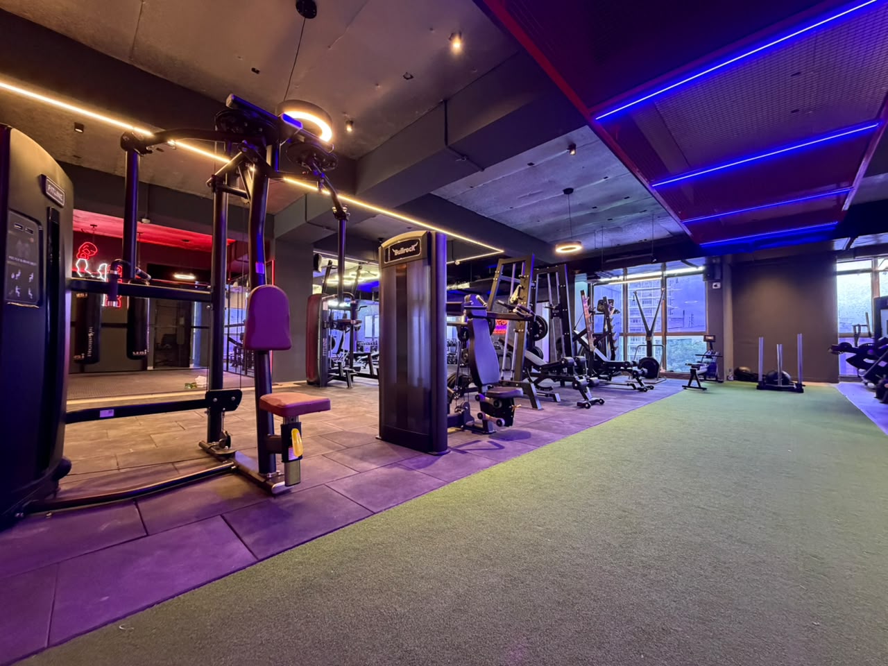 Strength machines and functional turf on the training floor